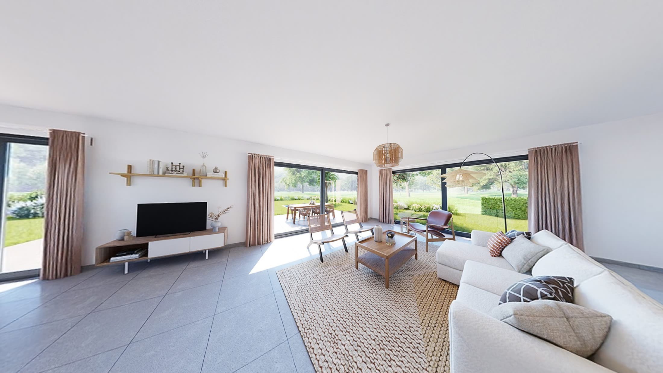 Salon lumineux d'une villa, baies vitrées toute hauteur ouvertes sur le jardin